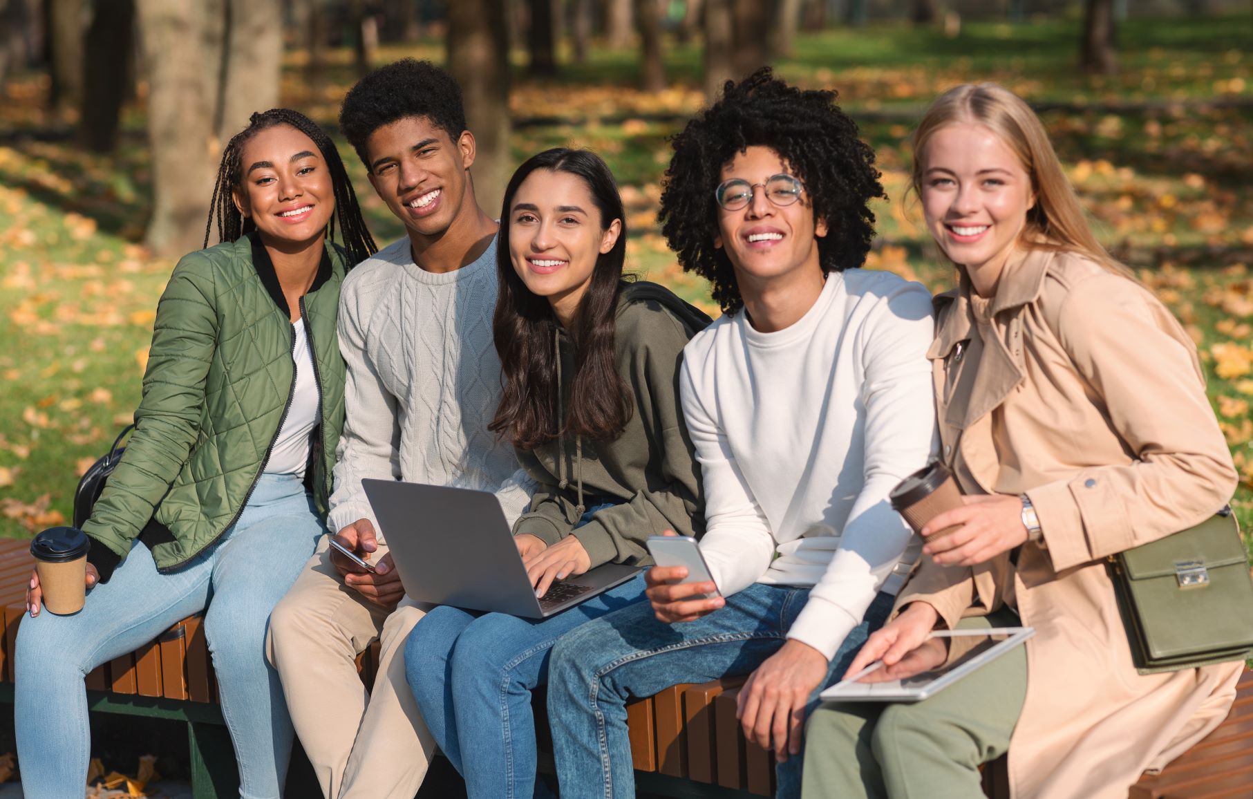 graduate students sitting on bench